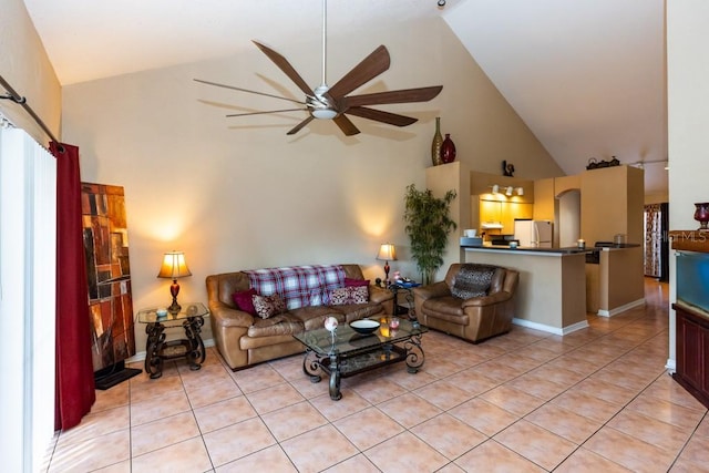 tiled living room featuring high vaulted ceiling and ceiling fan