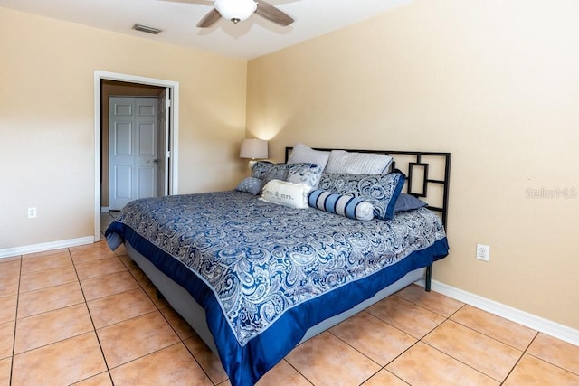 tiled bedroom featuring ceiling fan