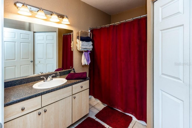 bathroom featuring vanity and tile patterned flooring