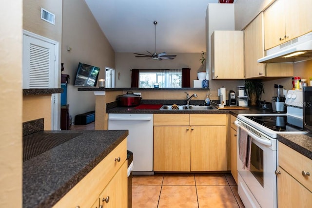 kitchen with light tile patterned flooring, white appliances, sink, and light brown cabinets