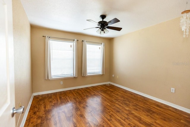 spare room featuring ceiling fan and hardwood / wood-style floors