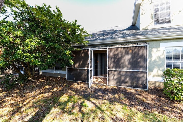 back of property featuring a sunroom