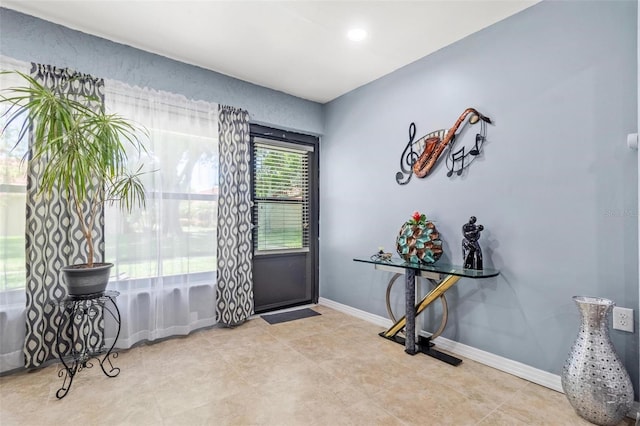 entryway featuring baseboards