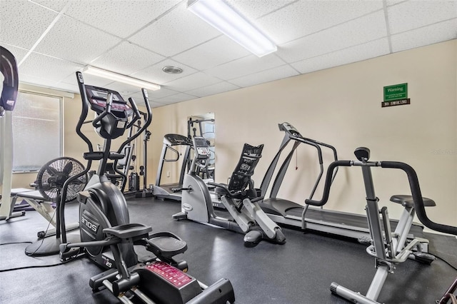 workout area with a drop ceiling