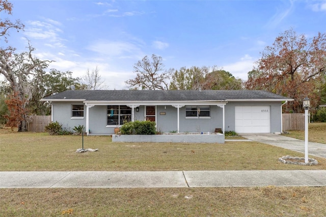 ranch-style house with a garage and a front yard