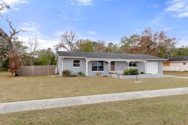 ranch-style house with a garage and a front yard