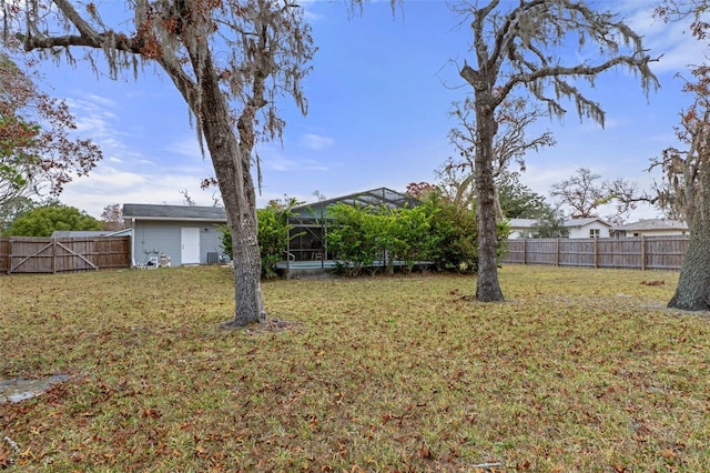 view of yard with a lanai