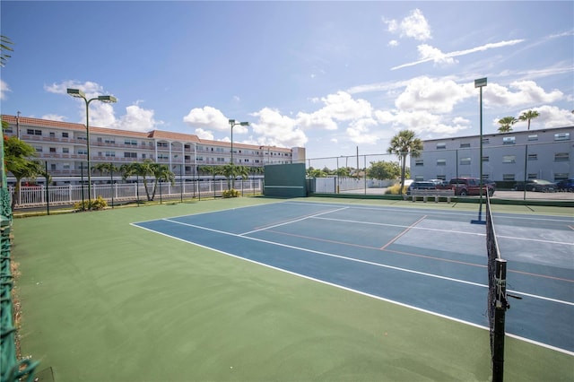 view of sport court with fence