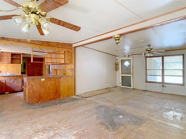 interior space featuring ceiling fan and lofted ceiling