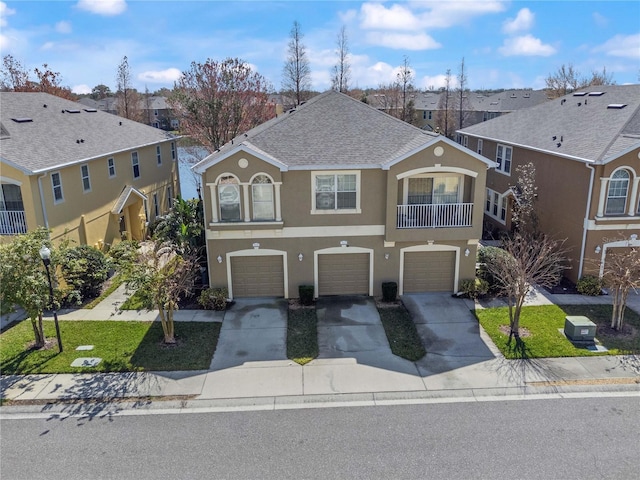 8835 Moonlit Meadows Loop, Riverview, FL 33578 - view of front of house with driveway, a garage, stucco siding, and a residential view