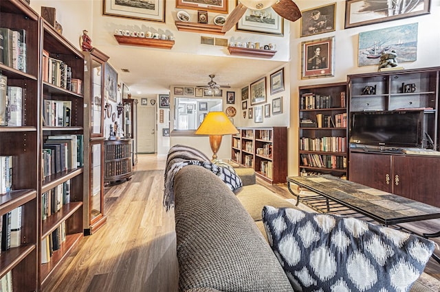 interior space featuring light hardwood / wood-style floors and ceiling fan