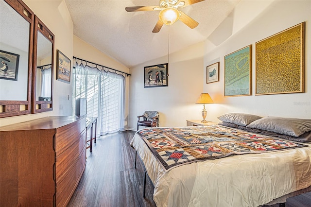 bedroom featuring vaulted ceiling, a textured ceiling, dark hardwood / wood-style flooring, ceiling fan, and access to exterior