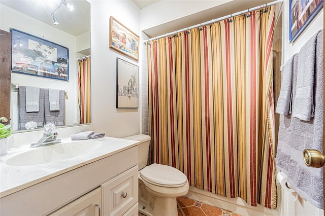 bathroom with vanity, tile patterned floors, and toilet