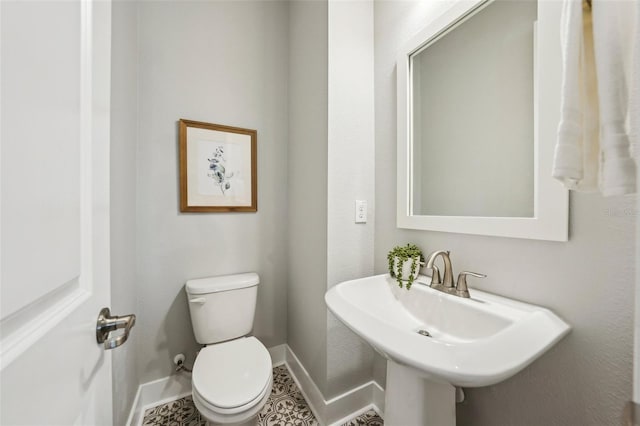 bathroom with toilet and sink