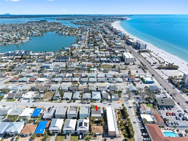 aerial view with a water view and a beach view