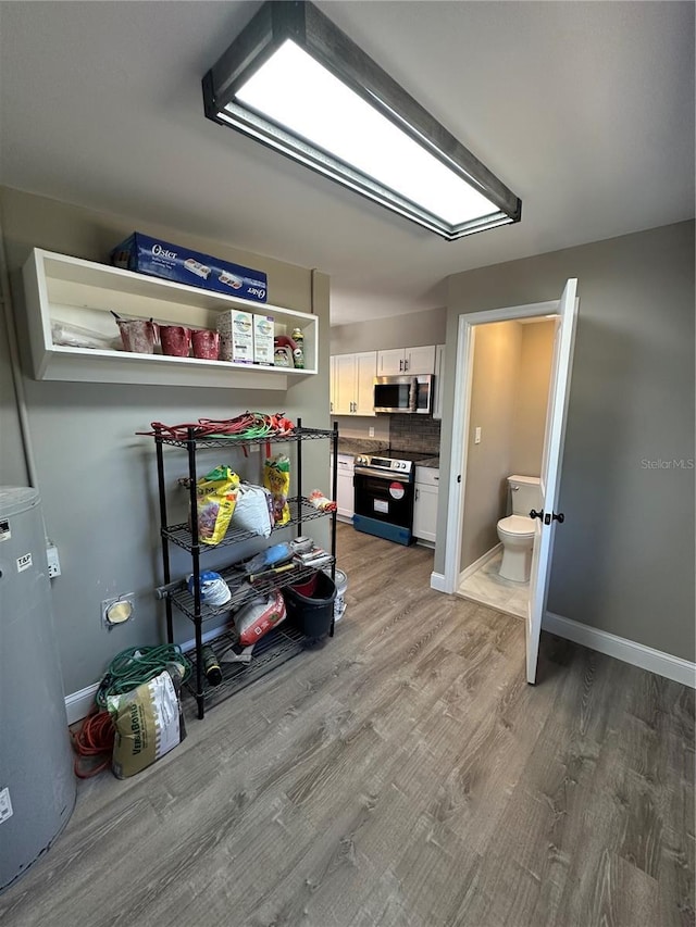 interior space with light wood finished floors and baseboards