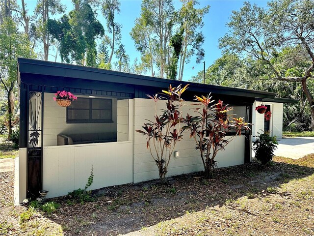 view of home's exterior with concrete block siding