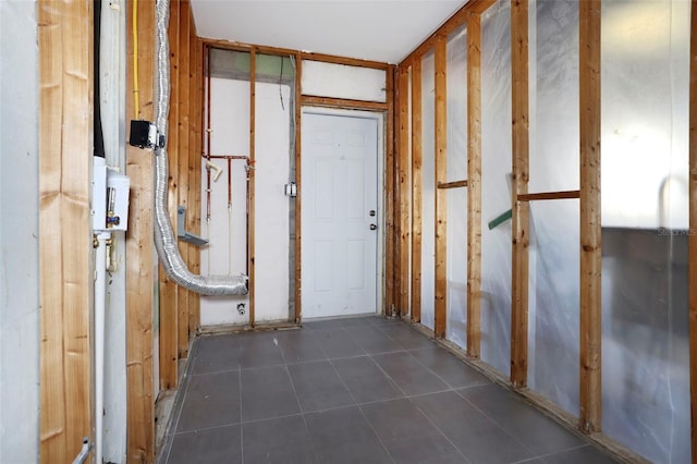 miscellaneous room with dark tile patterned flooring