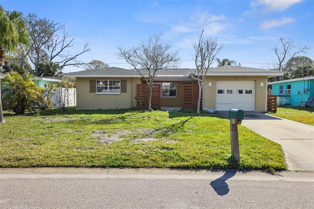 ranch-style home with a garage and a front yard