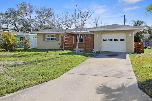 ranch-style home with a garage and a front yard