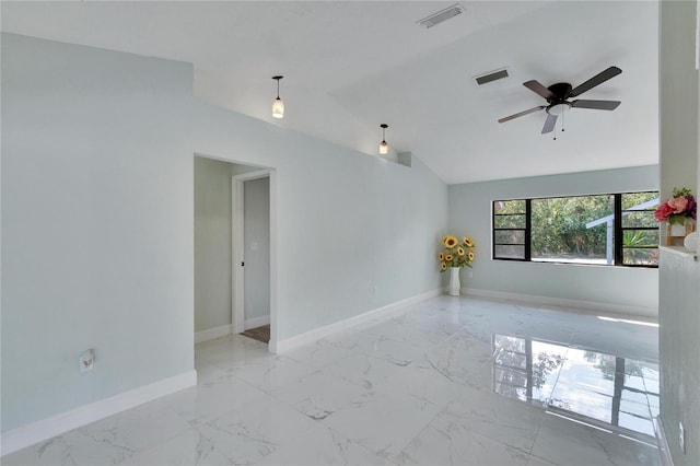 empty room featuring vaulted ceiling and ceiling fan