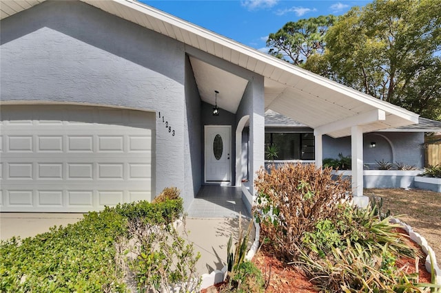 doorway to property featuring a garage