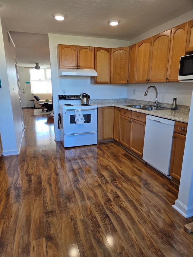 kitchen featuring range with electric stovetop, dishwasher, sink, and dark hardwood / wood-style floors