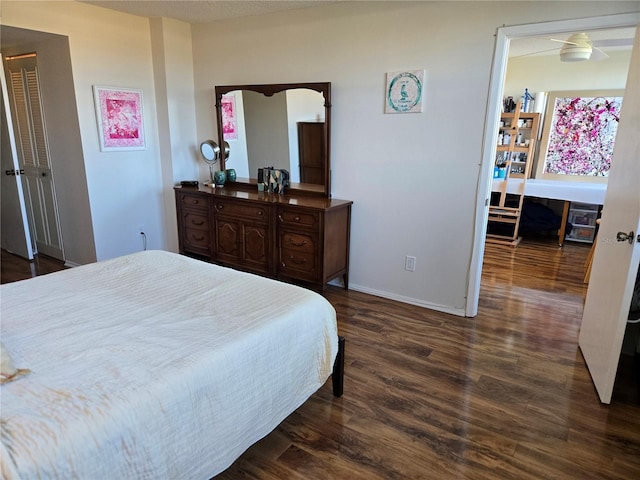 bedroom with dark hardwood / wood-style flooring