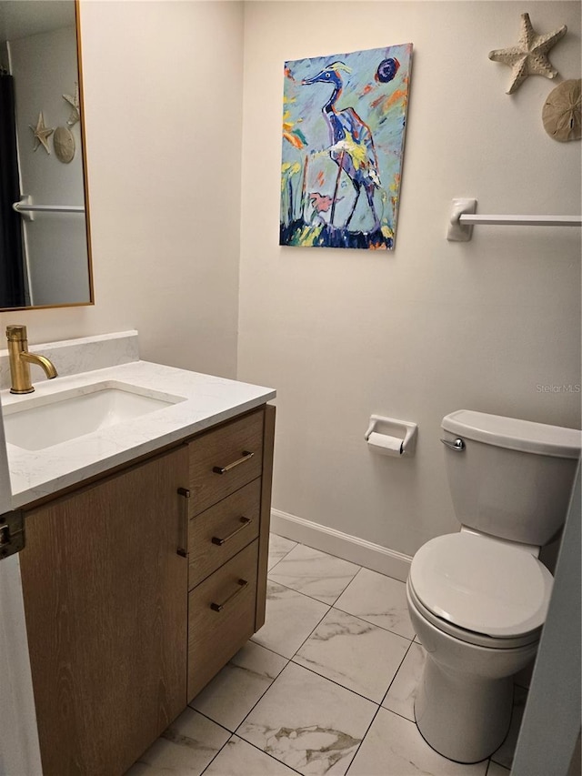 bathroom with vanity and toilet