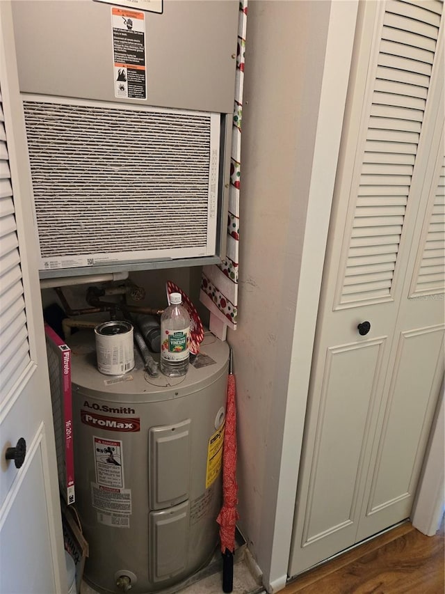 utility room with water heater