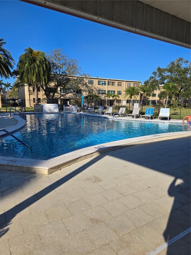 view of swimming pool featuring a patio area