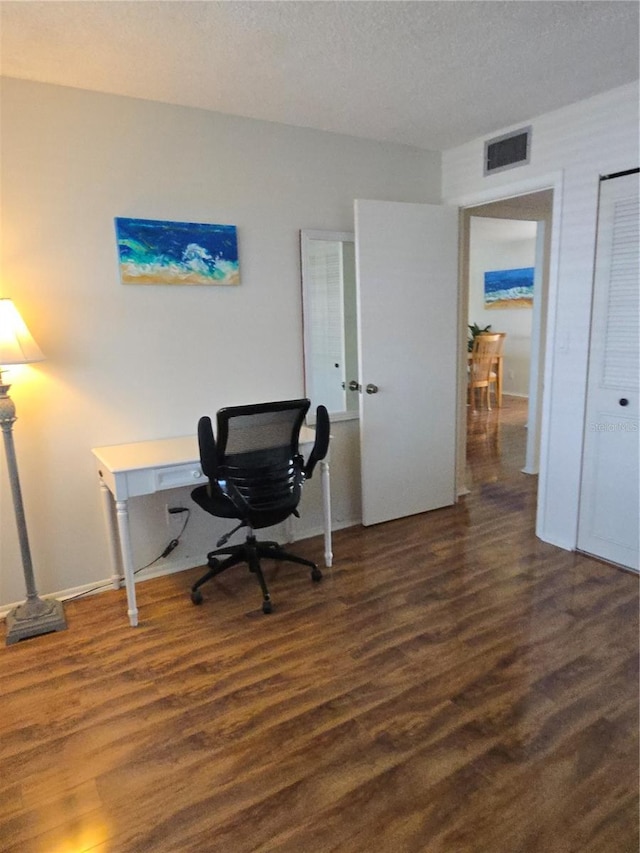 4915 Bay St NE Unit 322, Saint Petersburg, FL 33703 - office area featuring dark wood-type flooring and a textured ceiling