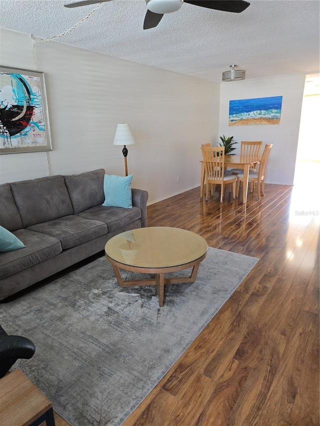 4915 Bay St NE Unit 322, Saint Petersburg, FL 33703 - living room with a ceiling fan, wood finished floors, and a textured ceiling