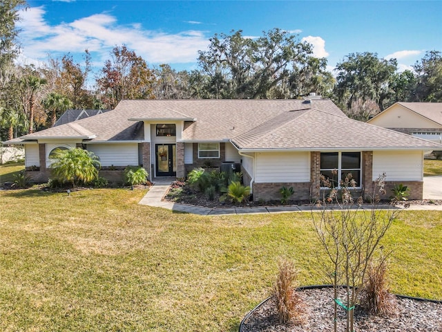 ranch-style home featuring a front lawn