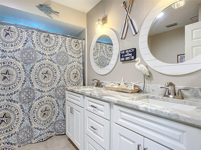 bathroom featuring vanity and tile patterned floors