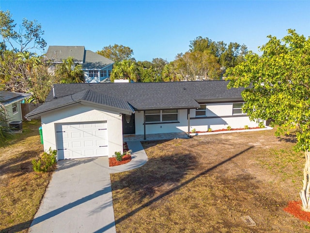 ranch-style house featuring a garage and a front yard