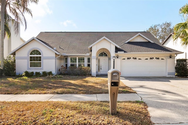 ranch-style home featuring a garage