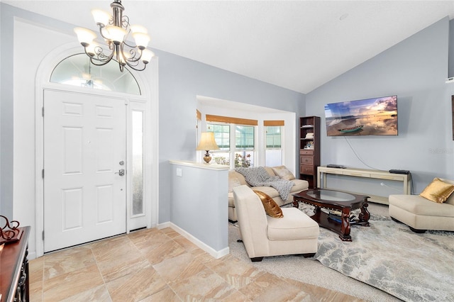 foyer entrance featuring lofted ceiling and a chandelier