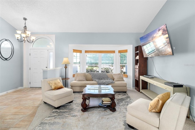 living room with lofted ceiling and a chandelier