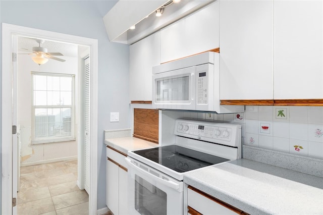 kitchen with white cabinetry, white appliances, ceiling fan, and decorative backsplash