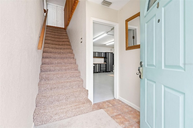 entryway featuring light tile patterned floors