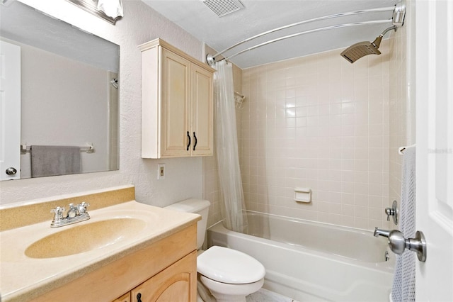 full bathroom with shower / bathtub combination with curtain, vanity, and toilet