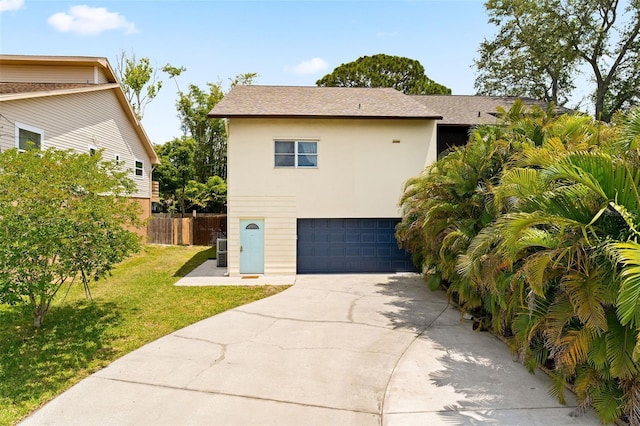 view of home's exterior with a garage and a lawn