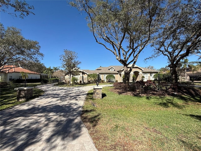 view of front of house with a residential view and a front lawn