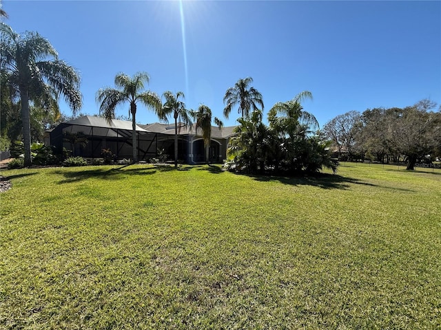 view of yard with a lanai