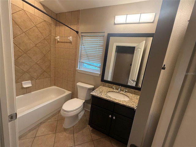 full bathroom with toilet, tile patterned flooring, washtub / shower combination, and vanity