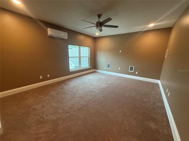 carpeted spare room featuring recessed lighting, a ceiling fan, visible vents, baseboards, and a wall mounted air conditioner