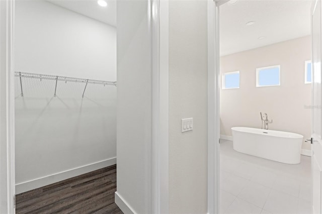 bathroom featuring a washtub