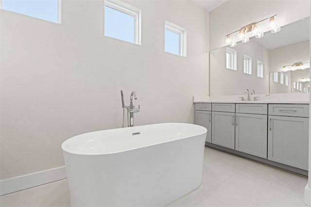 bathroom with vanity and a bathtub