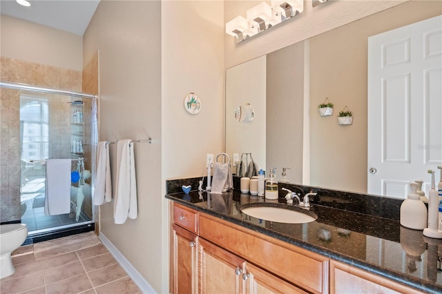 bathroom with vanity, tile patterned flooring, a shower with shower door, and toilet